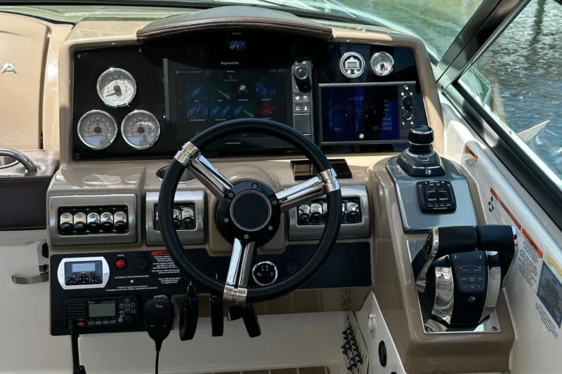 Slide: The Image of 2019 Formula 350 Crossover Bowrider dashboard with steering wheel and control panels. - 17