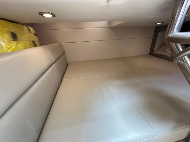 Slide: The Image of 2019 Formula 350 Crossover Bowrider cabin interior with beige seating and overhead lighting. - 28