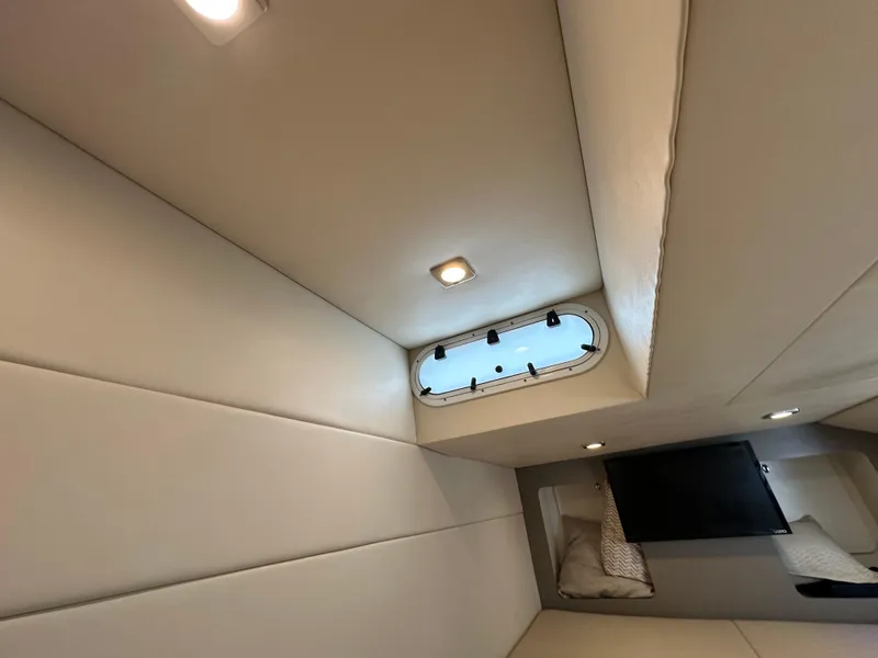 Slide: The Image of 2019 Formula 350 Crossover Bowrider cabin interior with window and lighting. - 31
