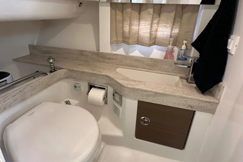 Slide: The Image of 2019 Formula 350 Crossover Bowrider bathroom with modern fixtures and sleek design. - 33