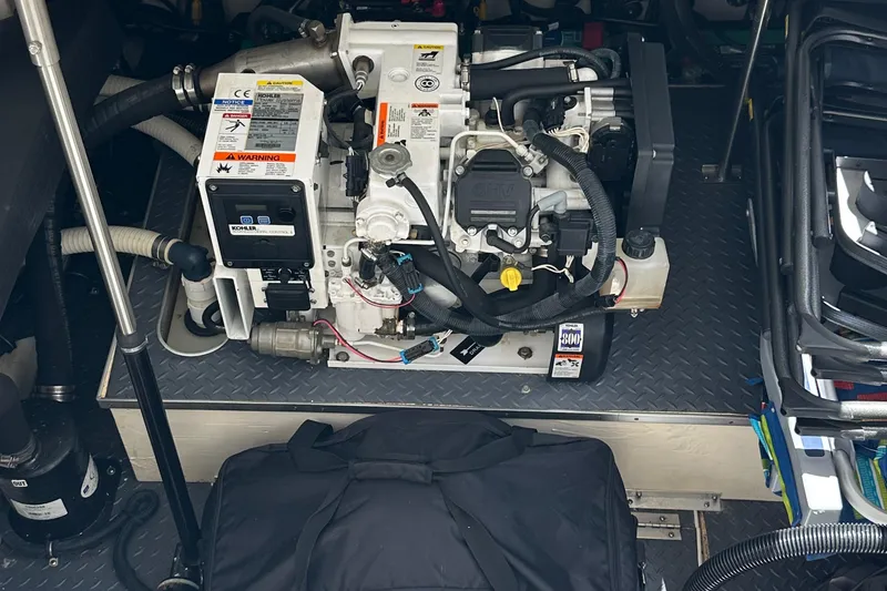 Slide: The Image of Engine compartment of a 2019 Formula 350 Crossover Bowrider, showcasing mechanical components. - 37