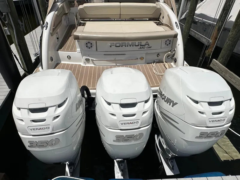 Slide: The Image of 2019 Formula 350 Crossover Bowrider with triple Mercury Verado 350 engines, docked. - 6
