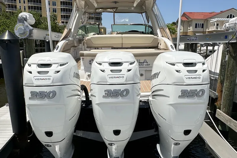 Slide: The Image of 2019 Formula 350 Crossover Bowrider with triple Mercury Verado 350 engines docked. - 8