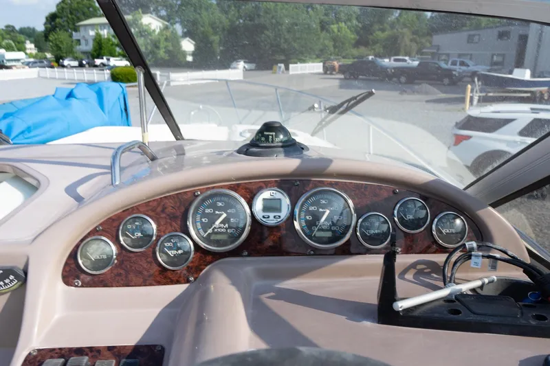 Slide: The Image of Dashboard of a 2004 Regal Commodore 2765 boat with gauges and controls. - 25