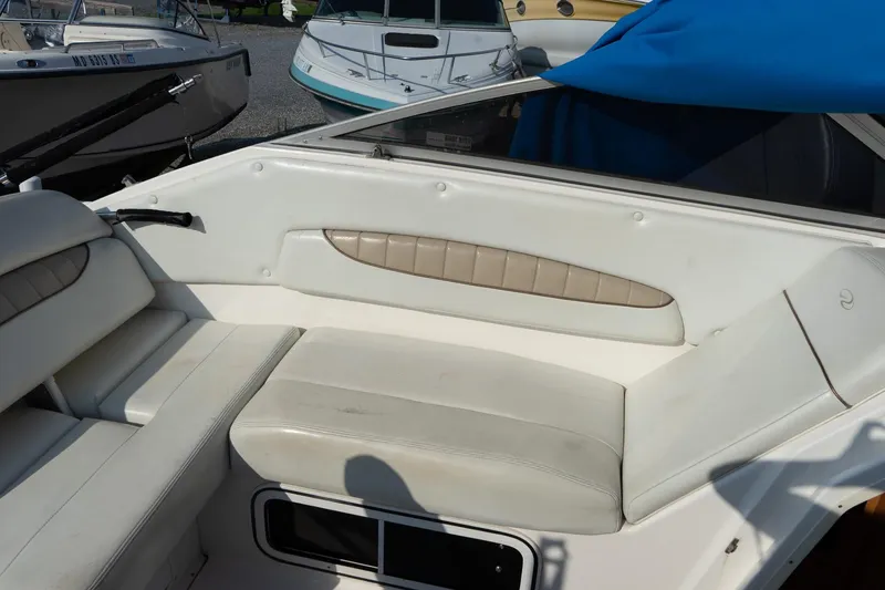 Slide: The Image of 2004 Regal Commodore 2765 boat interior with white seating and beige accents. - 26