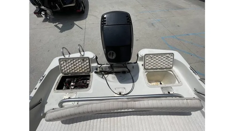 Slide: The Image of 2002 Bay Stealth 1880 boat console with storage compartments and steering wheel. - 18