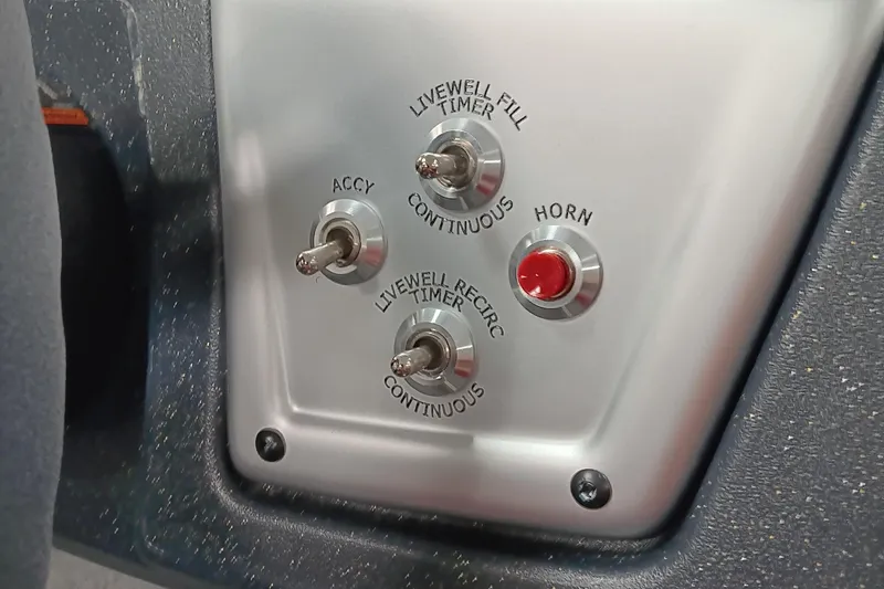 Slide: The Image of Control panel of 2025 Tracker Pro Team 175 boat with switches and horn button. - 11