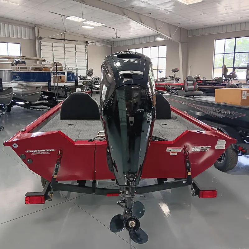 Slide: The Image of 2025 Tracker Pro Team 175 boat with Mercury 75 engine in showroom. - 3