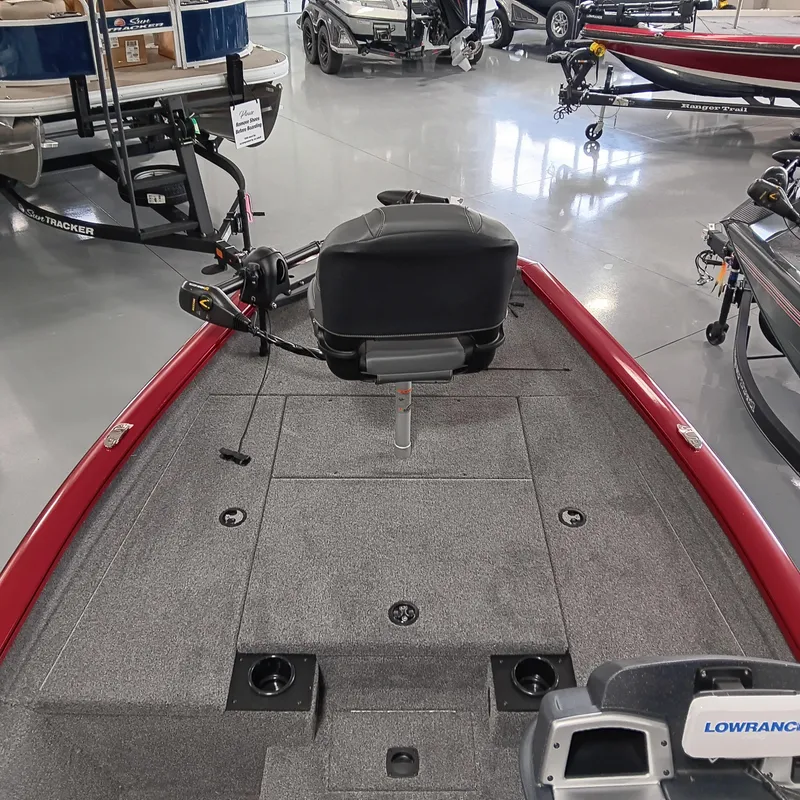 Slide: The Image of 2025 Tracker Pro Team 175 boat interior with fishing seat and equipment in showroom. - 6