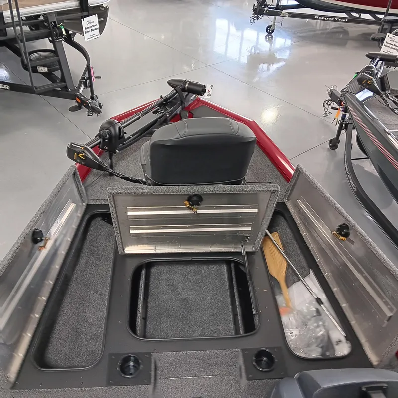 Slide: The Image of 2025 Tracker Pro Team 175 boat interior with open storage compartments and seating. - 7