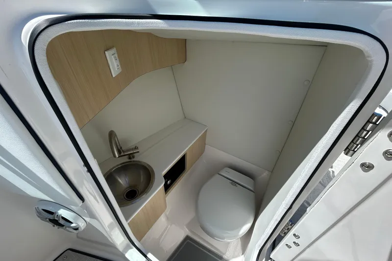 Slide: The Image of Compact bathroom in 2026 Regal LX4 boat with sink and toilet. - 10
