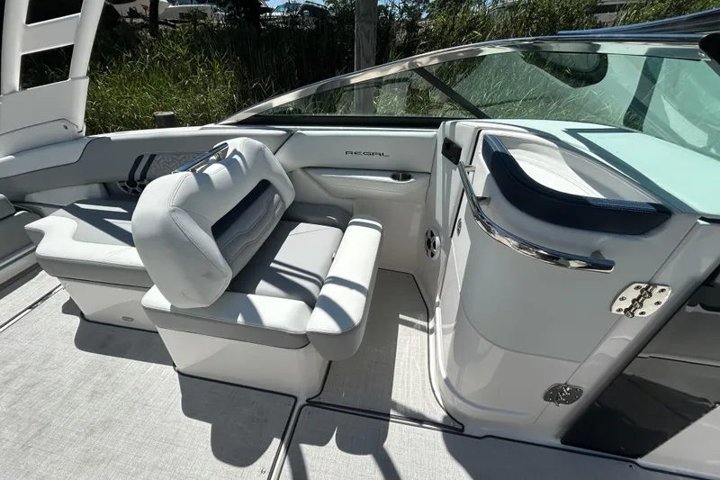 Slide: The Image of 2026 Regal LX4 boat interior with sleek seating and modern design. - 8