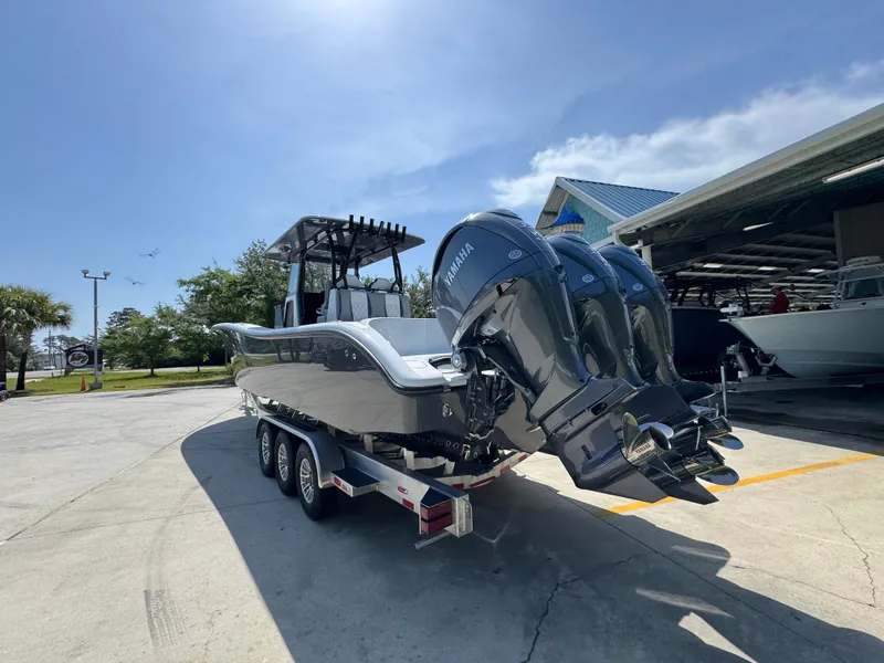 Slide: The Image of 2026 Yellowfin 36 Offshore boat on trailer with powerful outboard engines. - 15