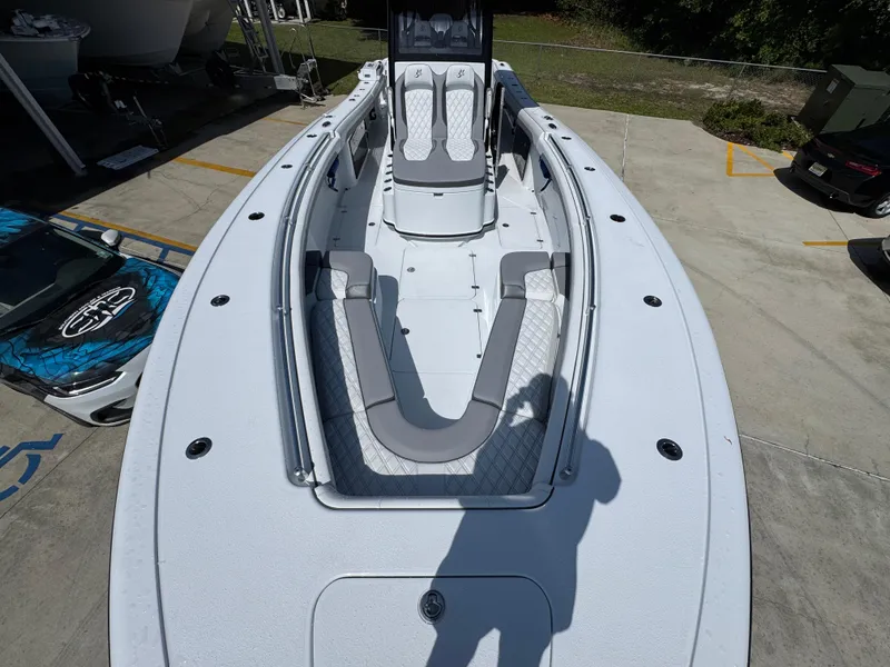 Slide: The Image of 2026 Yellowfin 36 Offshore boat, top view, docked in a marina. - 19