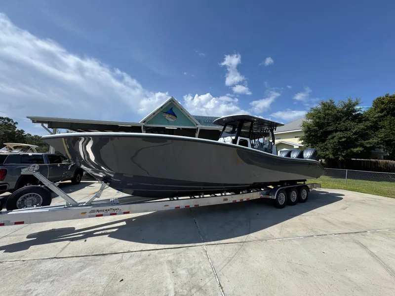 Slide: The Image of 2026 Yellowfin 36 Offshore boat on trailer under clear blue sky. - 2