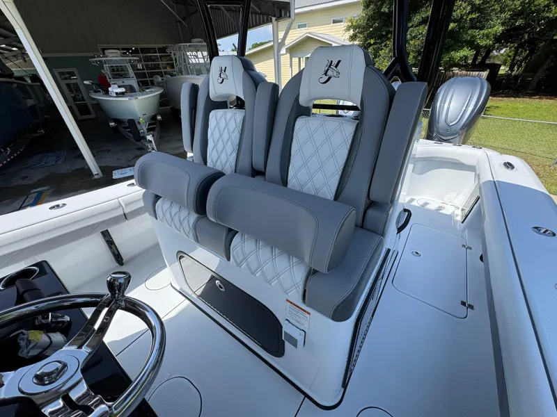 Slide: The Image of 2026 Yellowfin 36 Offshore boat with luxurious seating and modern steering wheel. - 28