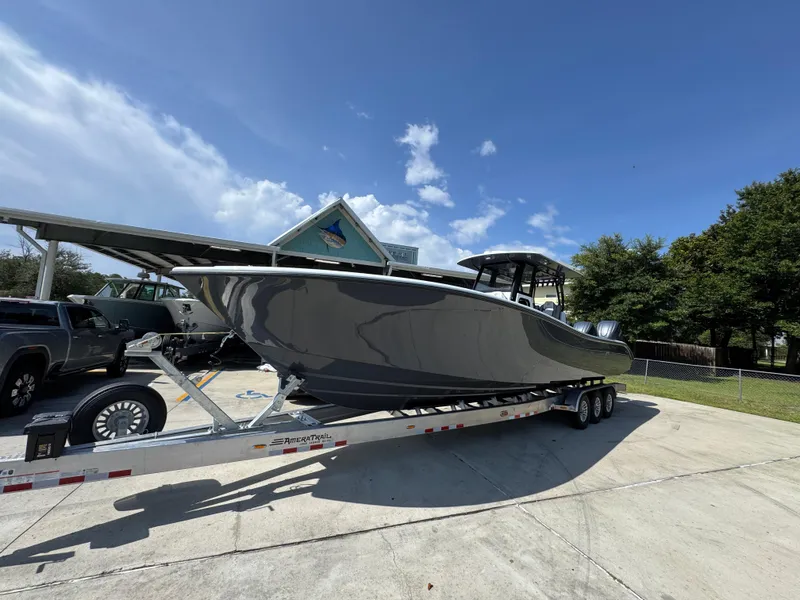 Slide: The Image of 2026 Yellowfin 36 Offshore boat on trailer under clear blue sky. - 3