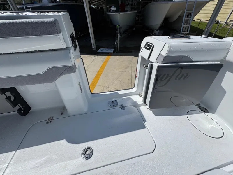 Slide: The Image of 2026 Yellowfin 36 Offshore boat interior with open storage compartments and seating. - 40