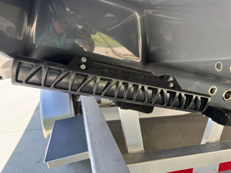 Slide: The Image of 2026 Yellowfin 36 Offshore boat detail showing hull and trailer components. - 42