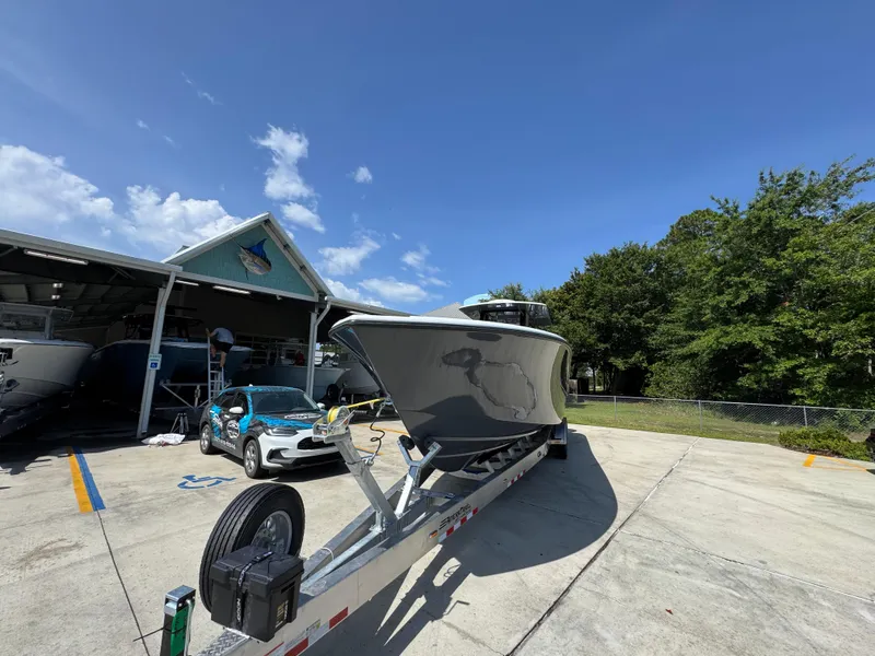 Slide: The Image of 2026 Yellowfin 36 Offshore boat on trailer in sunny outdoor setting. - 5