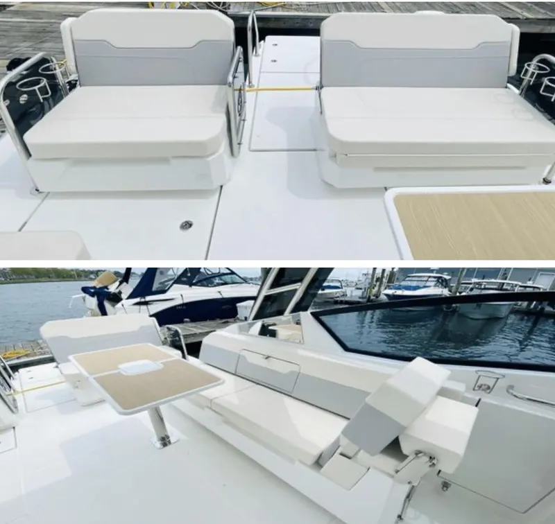 Slide: The Image of Aquila 32 Sport 2022 boat interior with white seating and adjustable table. - 8