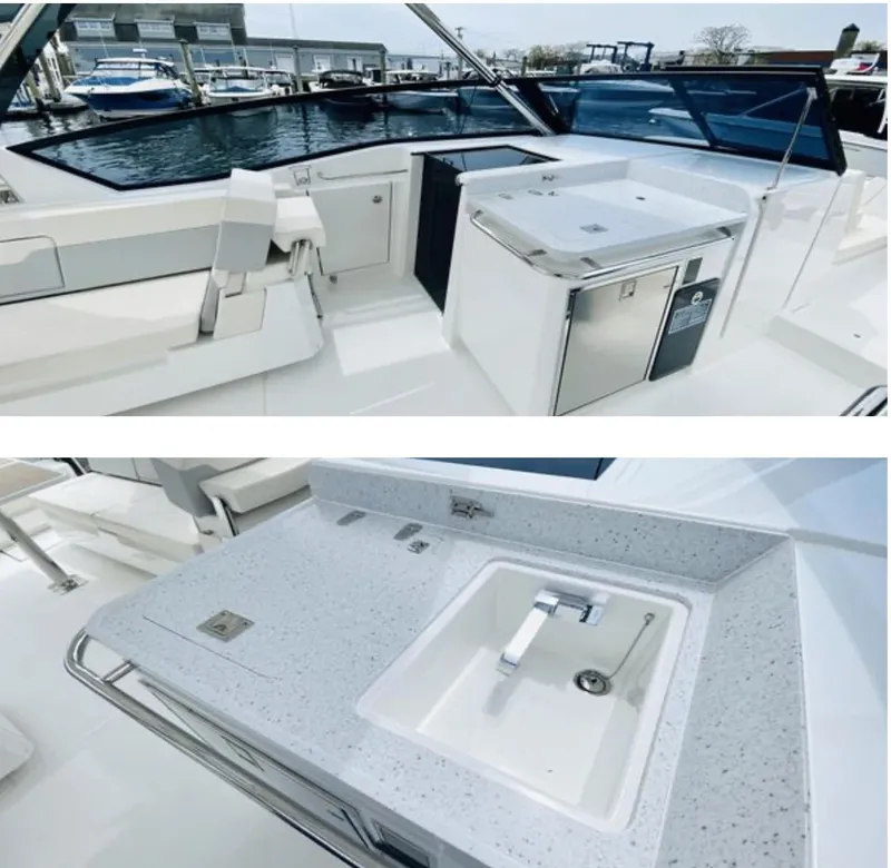 Slide: The Image of 2022 Aquila 32 Sport yacht interior with modern kitchenette and sink area. - 9