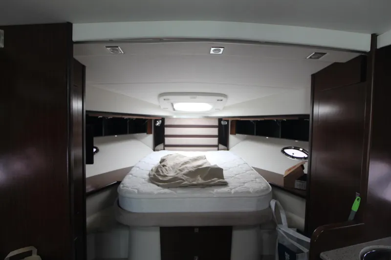 Slide: The Image of Interior cabin of 2013 Cruisers Yachts 430 SC with bed and portholes. - 11