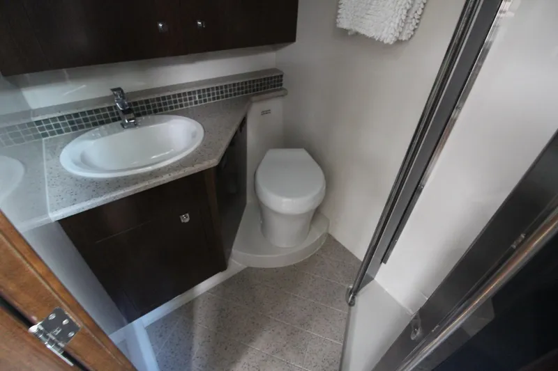Slide: The Image of Bathroom interior of 2013 Cruisers Yachts 430 SC, featuring sink and toilet. - 20