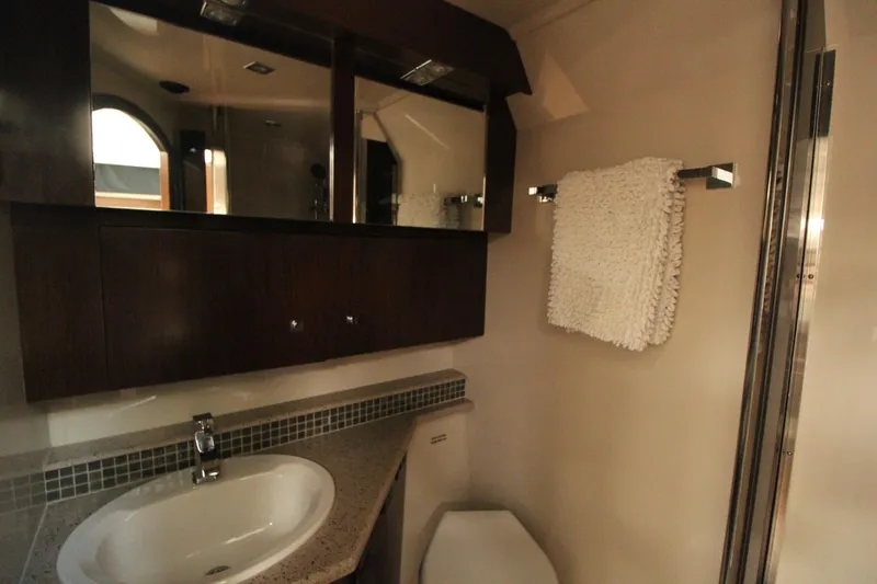 Slide: The Image of Luxurious bathroom in 2013 Cruisers Yachts 430 SC with modern fixtures and elegant design. - 34