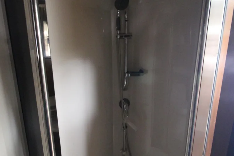 Slide: The Image of Shower area inside 2013 Cruisers Yachts 430 SC, featuring modern fixtures and sleek design. - 36