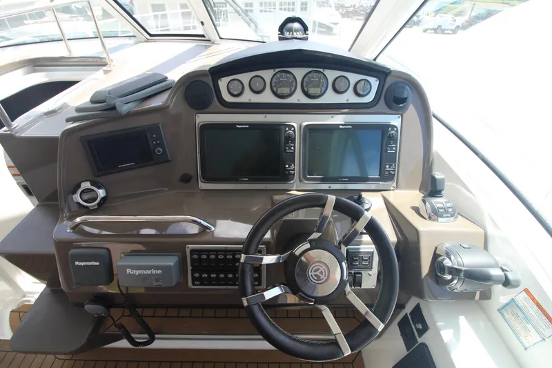 Slide: The Image of Helm of 2013 Cruisers Yachts 430 SC with Raymarine navigation systems and modern controls. - 4