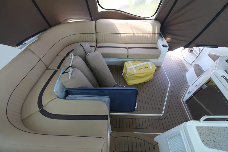 Slide: The Image of 2013 Cruisers Yachts 430 SC interior with tan seating and wooden flooring. - 6