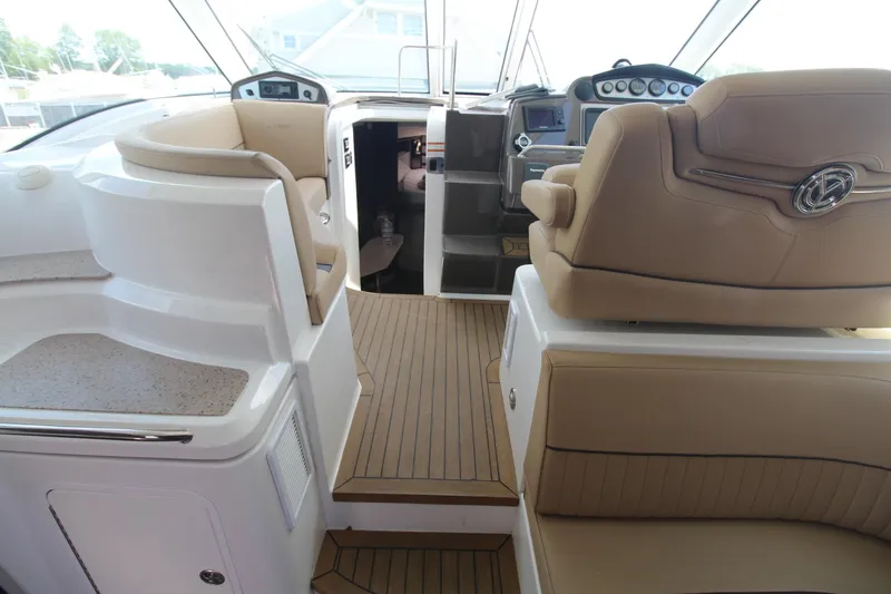 Slide: The Image of Interior of 2013 Cruisers Yachts 430 SC with luxurious seating and modern dashboard. - 8