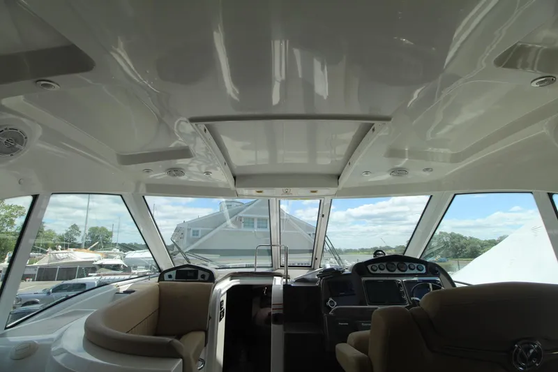 Slide: The Image of Interior view of 2013 Cruisers Yachts 430 SC helm with panoramic windows. - 9