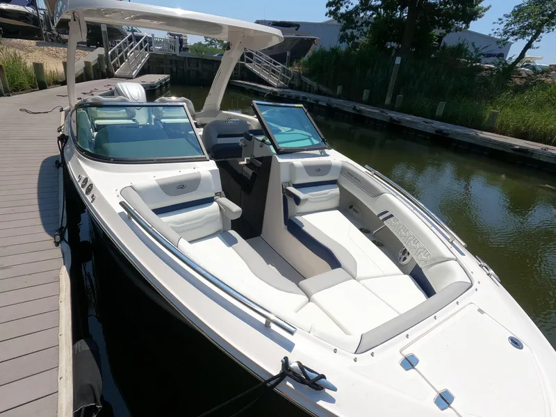 Slide: The Image of 2026 Regal LX6 boat docked, featuring sleek design and spacious seating. - 20