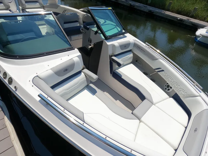 Slide: The Image of 2026 Regal LX6 boat interior with white seating and sleek design. - 21