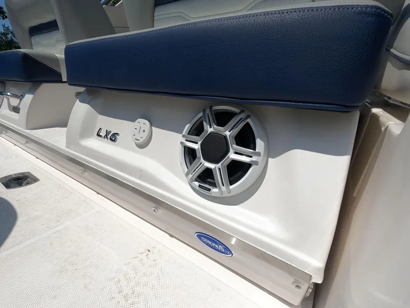 Slide: The Image of 2026 Regal LX6 boat interior with speaker and seating detail. - 3