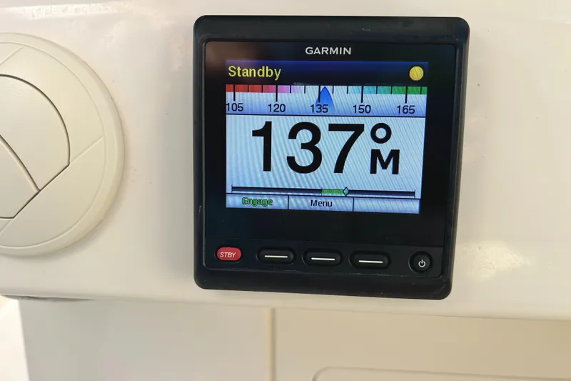 Slide: The Image of Garmin display on 2018 Grady-White Freedom 325 showing 137 degrees in standby mode. - 16