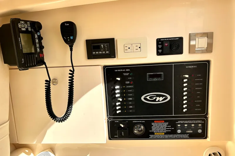 Slide: The Image of Control panel of 2018 Grady-White Freedom 325 boat with communication and electrical systems. - 19