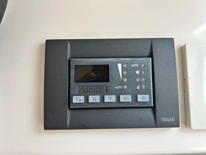 Slide: The Image of Control panel on a 2018 Grady-White Freedom 325 boat dashboard. - 20