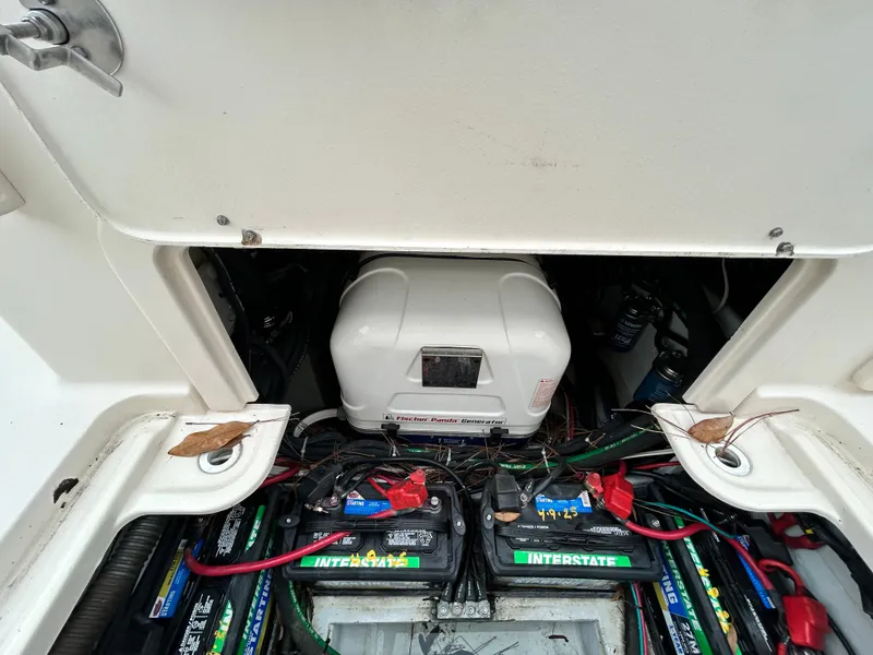 Slide: The Image of 2018 Grady-White Freedom 325 boat battery compartment with Interstate batteries and wiring. - 22