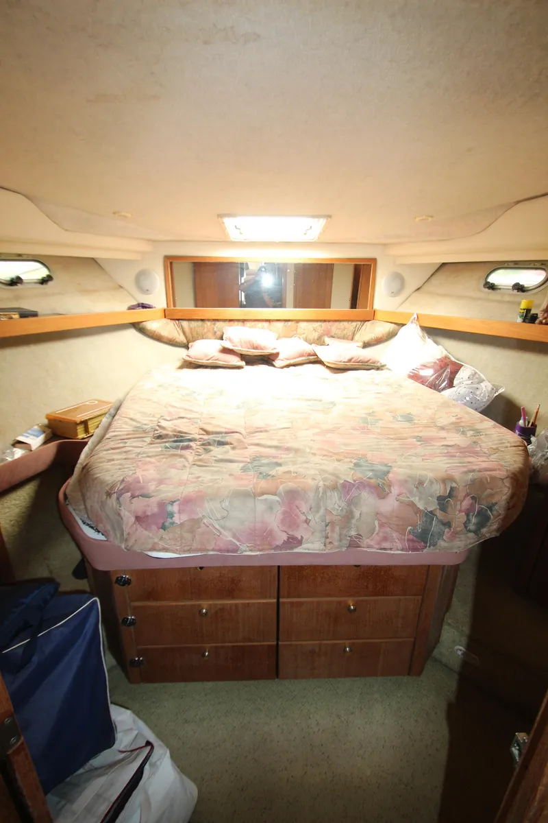Slide: The Image of Cozy bedroom in 1996 Bayliner 3988 Command Bridge Motoryacht with storage drawers. - 24