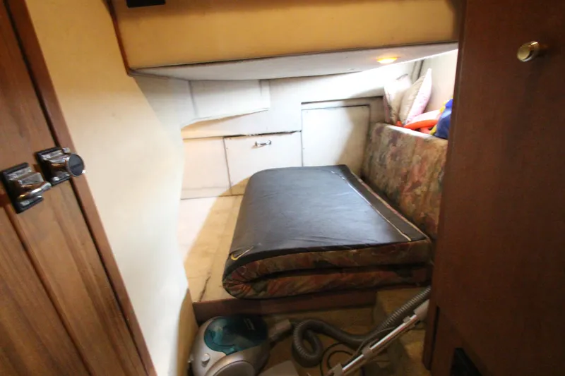 Slide: The Image of 1996 Bayliner 3988 Command Bridge Motoryacht interior cabin with bed and storage. - 32