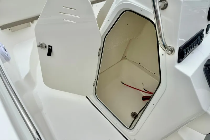 Slide: The Image of Open storage compartment on 2025 Key West 189 FS boat, showcasing interior space. - 17