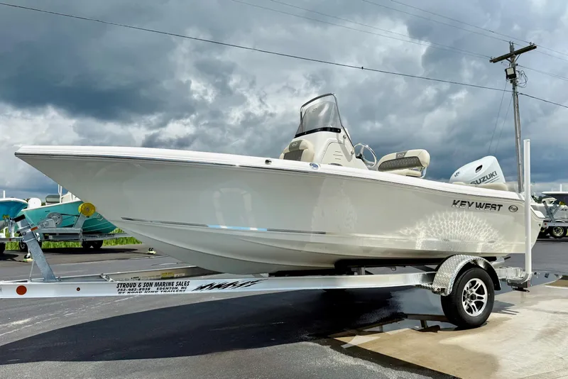 Slide: The Image of 2025 Key West 189 FS boat on trailer under cloudy sky. - 5
