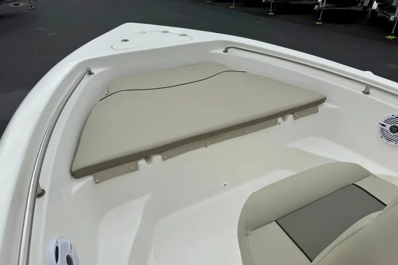 Slide: The Image of 2025 Key West 189 FS boat interior with beige seating and sleek design. - 9
