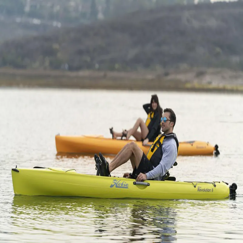 Slide: The Image of Two people kayaking on a lake with 2025 Hobie Revolution 11 kayaks. - 4