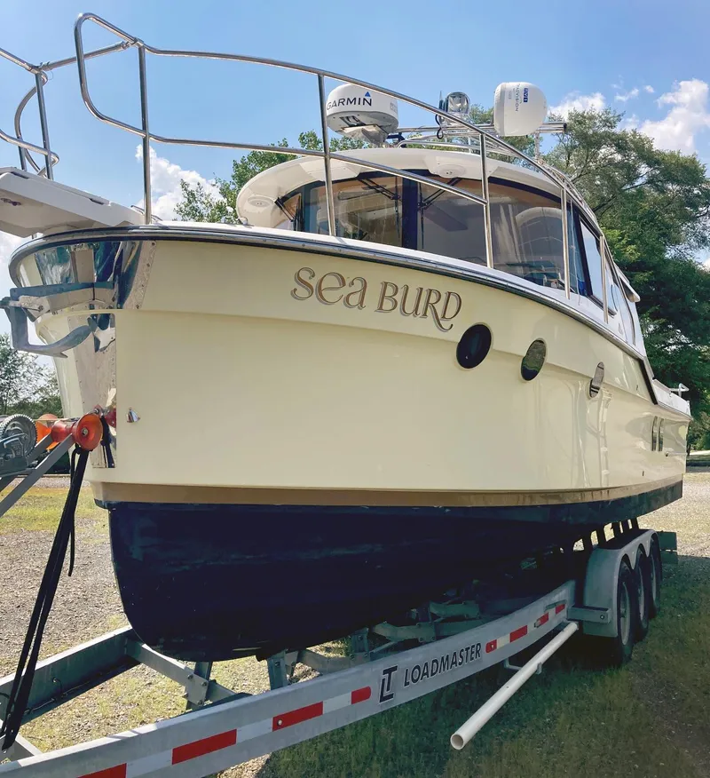 The Image of 2018 Ranger Tugs R-29 S boat named "Sea Burd" on a Loadmaster trailer. - 0