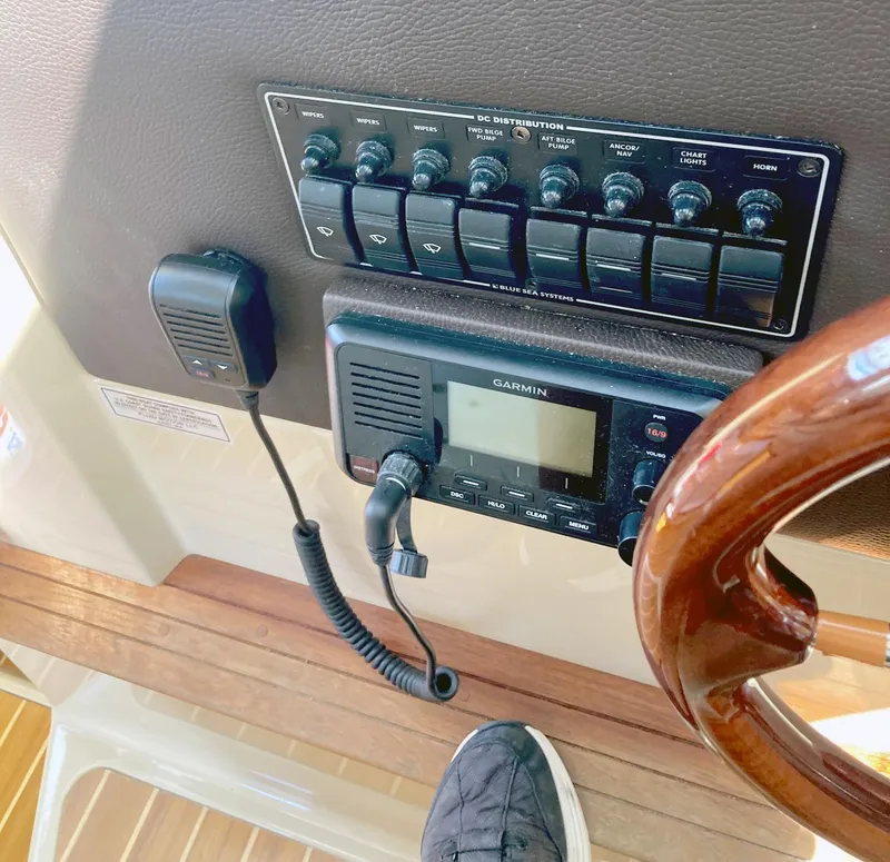 Slide: The Image of Control panel of 2018 Ranger Tugs R-29 S with Garmin device and wooden steering wheel. - 11