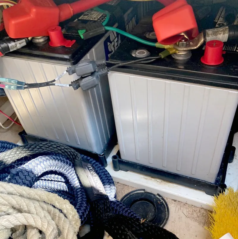 Slide: The Image of Batteries and ropes in a 2018 Ranger Tugs R-29 S boat compartment. - 22